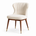 Chaise en bois avec tissu bouclé beige et pieds en laiton